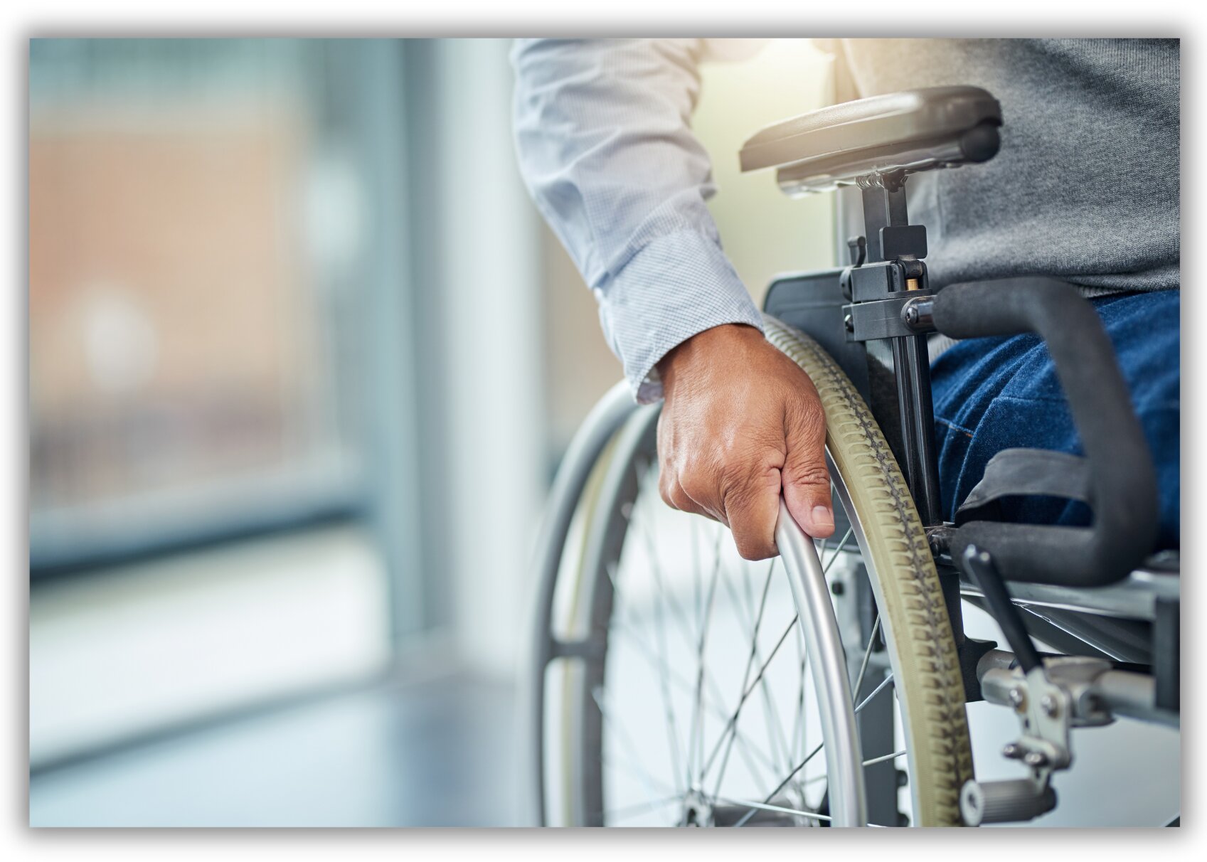 An ADA stock image of a a person in a wheelchair. Wheelchair iStock-1256027771.jpg